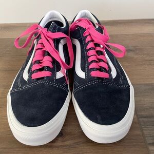 Navy Blue and White Vans Old Skool shoes.